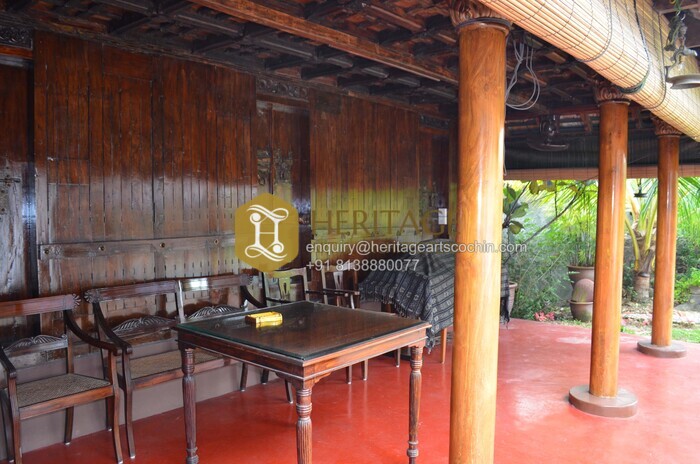 Handcarved wooden pillars and traditional interior in Kerala