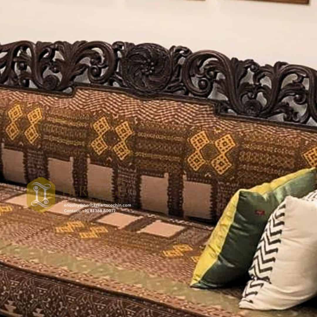 temple-inspired teak wood sofa set in kerala