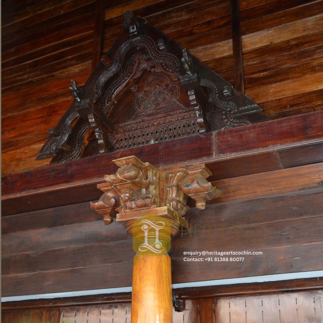 traditional carved wooden pillar in kerala