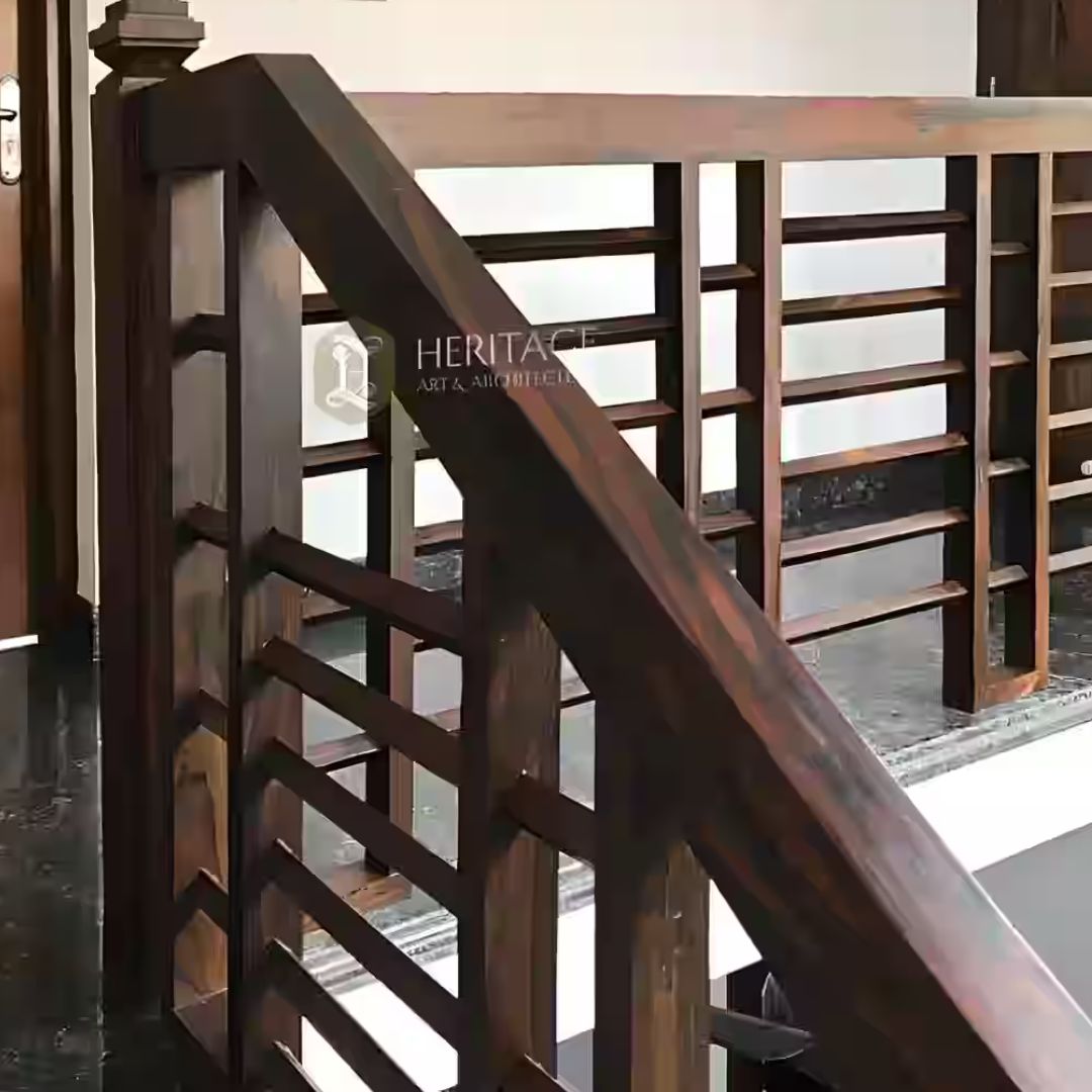 Traditional rosewood staircase railing with intricate carvings in India