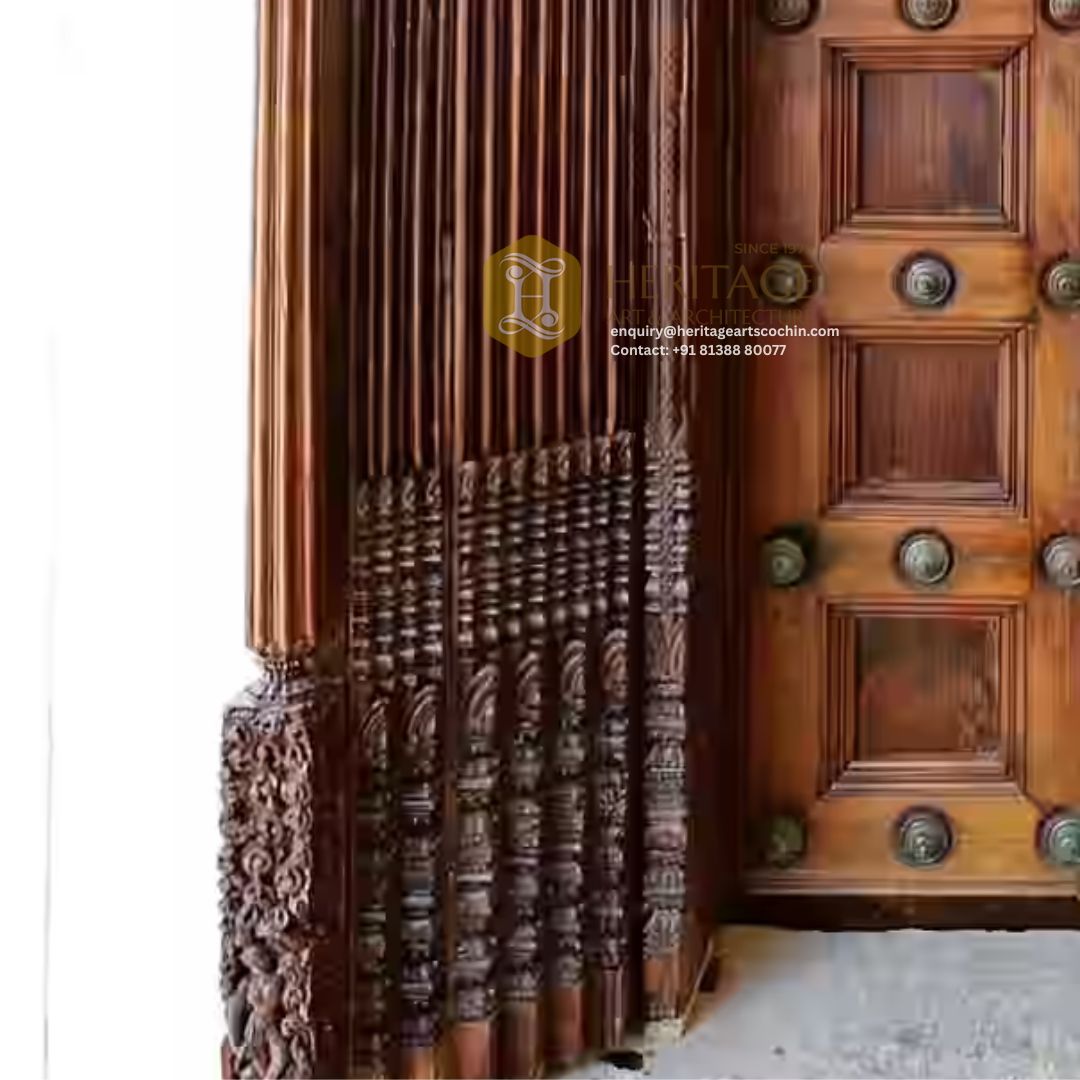 ornate wooden entrance door in Kerala